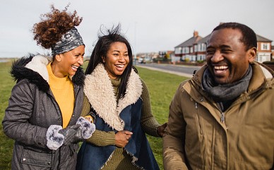 Black Family Outdoor Laughing And Smiling Smaller Version (1)